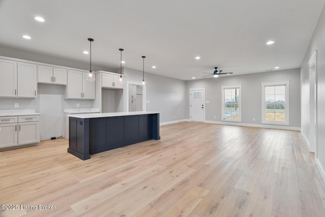 488 Capps Rd, Campbellsville, KY 42718 - kitchen with a ceiling fan, light wood-style floors, recessed lighting, a center island, and light countertops