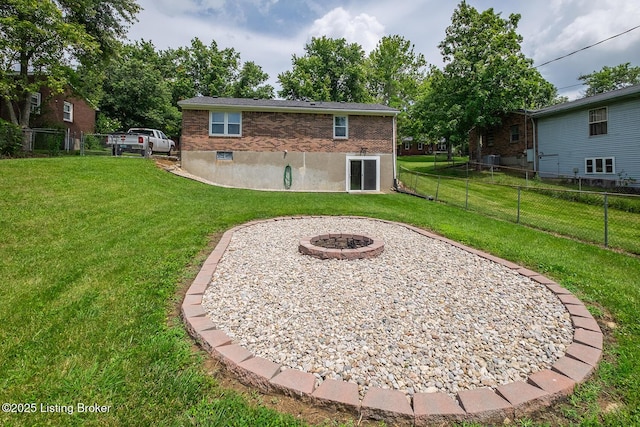 1008 E Mailback Way, Crestwood, KY 40014 - rear view of property with an outdoor fire pit and brick siding