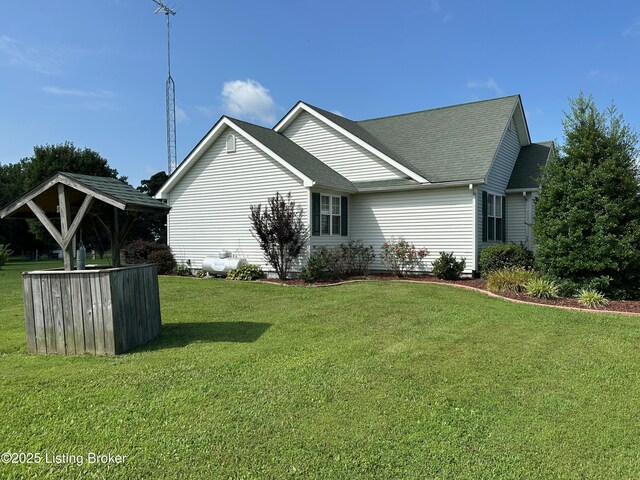64 Probus Rd, Leitchfield, KY 42754 - view of side of home with a lawn and roof with shingles