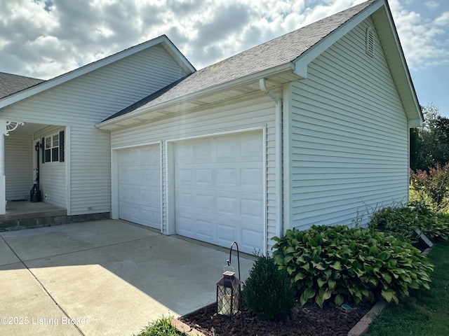 64 Probus Rd, Leitchfield, KY 42754 - view of home's exterior with concrete driveway, a garage, and roof with shingles