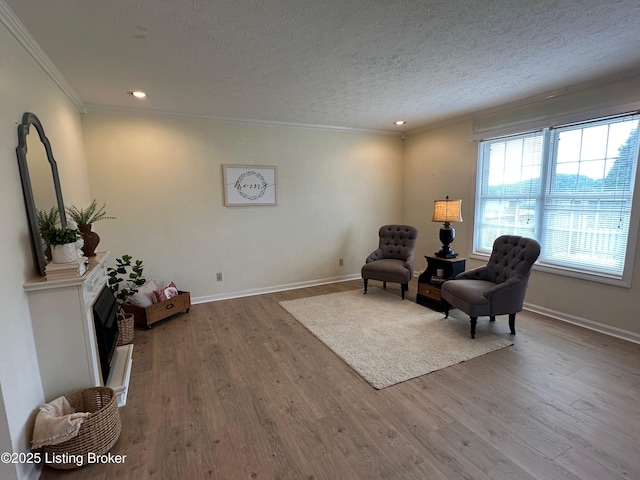 64 Probus Rd, Leitchfield, KY 42754 - sitting room featuring crown molding, wood finished floors, a textured ceiling, and recessed lighting