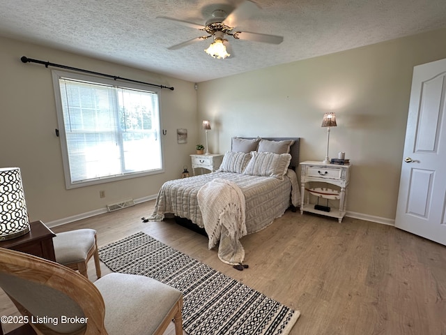 64 Probus Rd, Leitchfield, KY 42754 - bedroom with light wood-style flooring, a textured ceiling, and ceiling fan