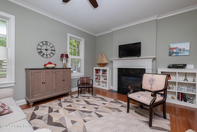 9508 Norton Commons Blvd Unit 102, Prospect, KY 40059 - living area with wood finished floors, crown molding, a tiled fireplace, and a ceiling fan