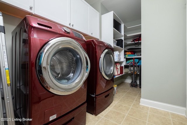 9508 Norton Commons Blvd Unit 102, Prospect, KY 40059 - laundry area featuring washer and clothes dryer, cabinet space, and light tile patterned floors