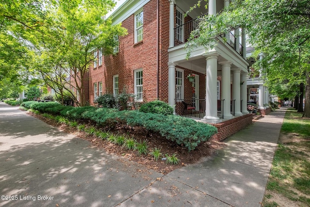 9508 Norton Commons Blvd Unit 102, Prospect, KY 40059 - view of side of property featuring brick siding and covered porch