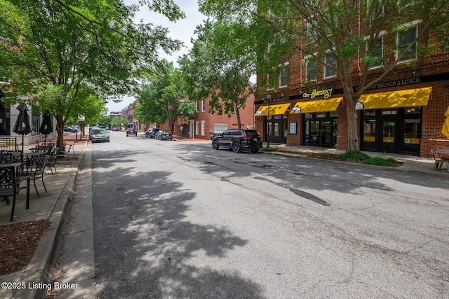 9508 Norton Commons Blvd Unit 102, Prospect, KY 40059 - view of asphalt road with sidewalks and curbs