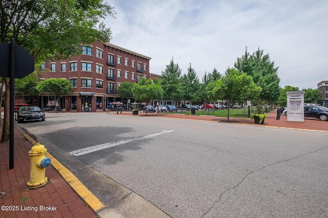 9508 Norton Commons Blvd Unit 102, Prospect, KY 40059 - view of asphalt road with sidewalks, curbs, and street lights