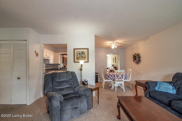 825 Crocus Dr, Radcliff, KY 40160 - living area featuring light carpet, a ceiling fan, and a textured ceiling