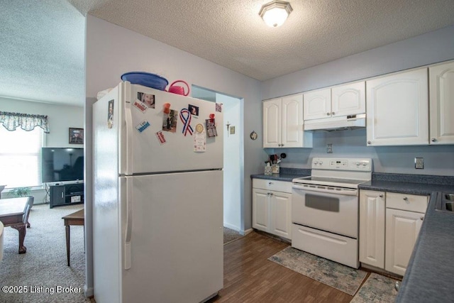 825 Crocus Dr, Radcliff, KY 40160 - kitchen with white appliances, under cabinet range hood, a textured ceiling, dark countertops, and white cabinets