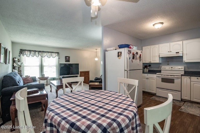 825 Crocus Dr, Radcliff, KY 40160 - dining room with a textured ceiling, dark wood finished floors, and a ceiling fan