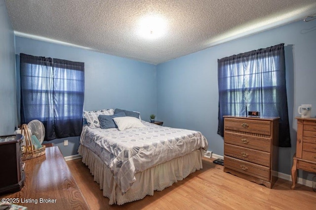 825 Crocus Dr, Radcliff, KY 40160 - bedroom featuring light wood-type flooring and a textured ceiling
