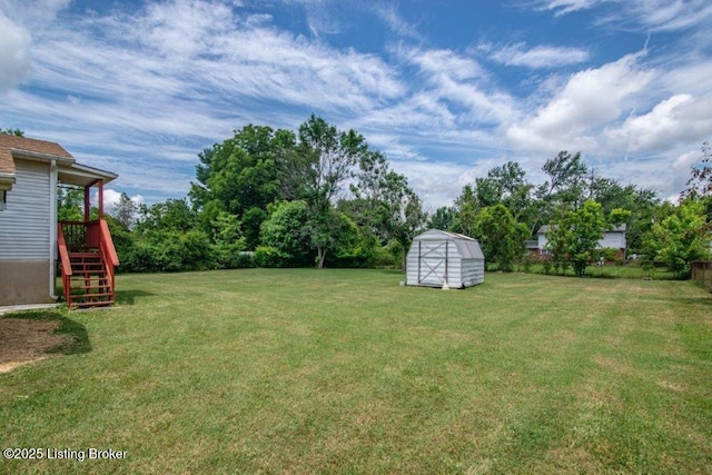 825 Crocus Dr, Radcliff, KY 40160 - view of grassy yard featuring stairway and a storage shed