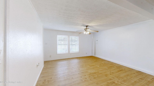 1117 6th St, Carrollton, KY 41008 - empty room with ceiling fan, a textured ceiling, ornamental molding, and light wood-type flooring