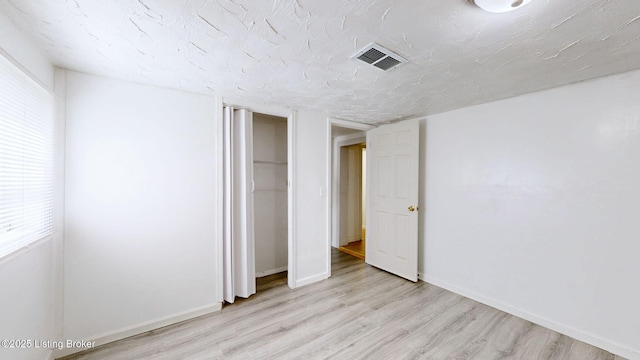 1117 6th St, Carrollton, KY 41008 - unfurnished bedroom featuring light wood-type flooring and a closet