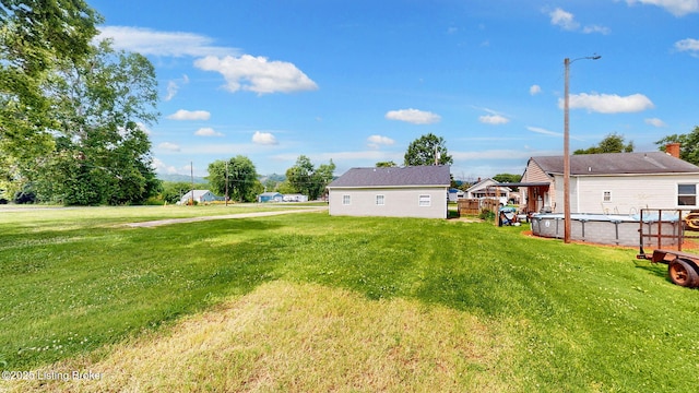 1117 6th St, Carrollton, KY 41008 - view of green lawn with an outdoor pool