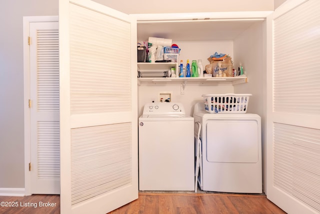 2745 Grinstead Dr Apt 113, Louisville, KY 40206 - washroom with washing machine and dryer and wood finished floors