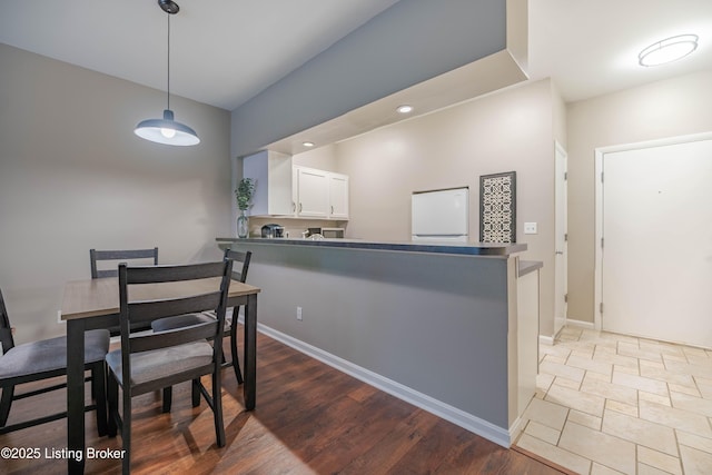 2745 Grinstead Dr Apt 113, Louisville, KY 40206 - dining space with recessed lighting and wood finished floors