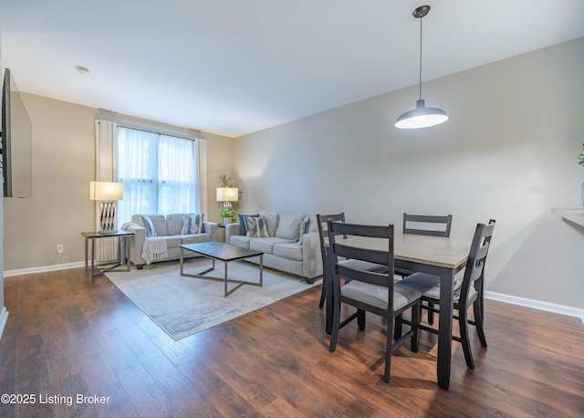 2745 Grinstead Dr Apt 113, Louisville, KY 40206 - living area featuring dark wood-style flooring and baseboards