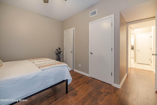 2745 Grinstead Dr Apt 113, Louisville, KY 40206 - bedroom with dark wood-style flooring and a ceiling fan