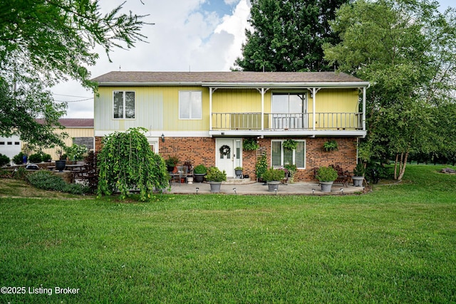 607 Hardin Springs Rd, Big Clifty, KY 42712 - view of front of house with a patio, a front lawn, a balcony, and brick siding