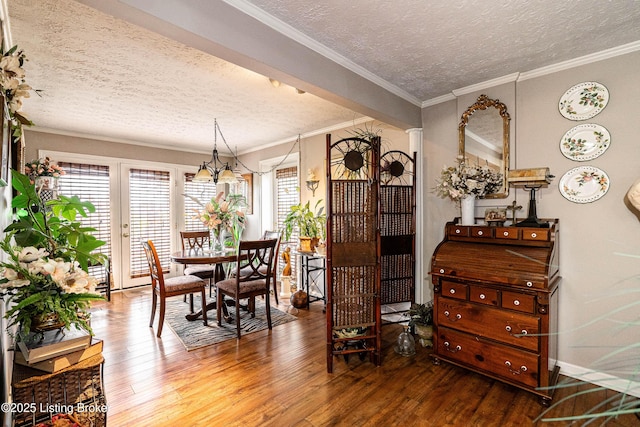 607 Hardin Springs Rd, Big Clifty, KY 42712 - dining space featuring a textured ceiling, hardwood / wood-style floors, a chandelier, and crown molding