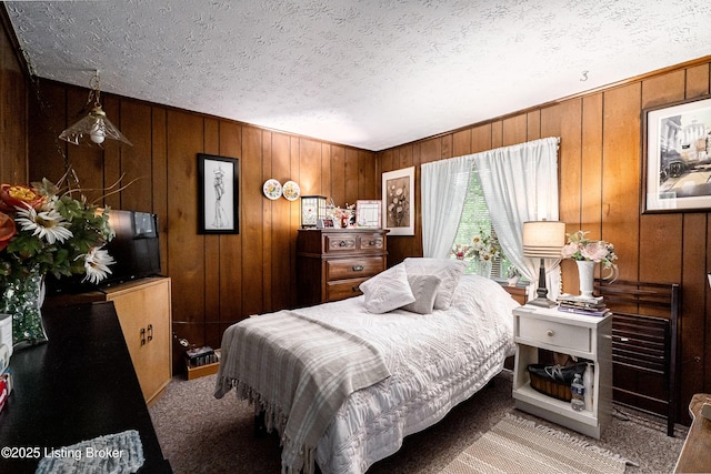 607 Hardin Springs Rd, Big Clifty, KY 42712 - bedroom featuring light colored carpet, a textured ceiling, and wooden walls