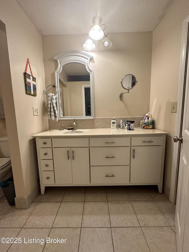 509 Piping Rock Rd, Brandenburg, KY 40108 - bathroom with vanity, a textured ceiling, and tile patterned floors