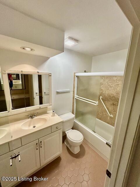 4125 Browns Ln Unit 117, Louisville, KY 40220 - bathroom with double vanity, tile patterned floors, and shower / bath combination with glass door