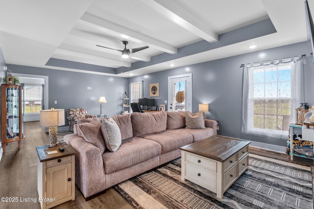 63 Davis Norton Ln, Harned, KY 40144 - living room featuring wood finished floors, a desk, beamed ceiling, healthy amount of natural light, and ceiling fan