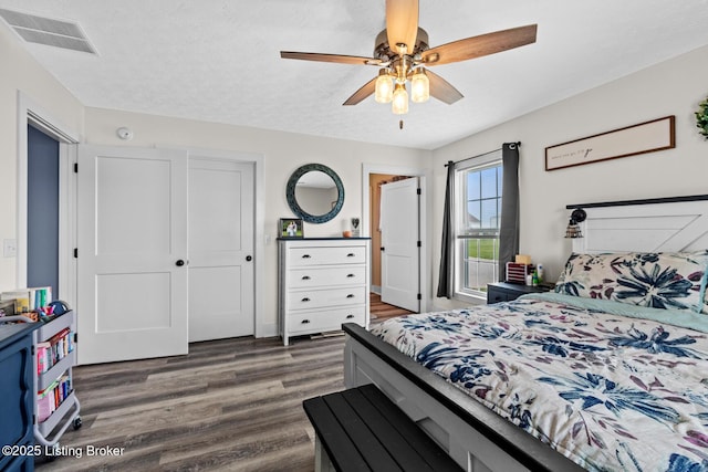 63 Davis Norton Ln, Harned, KY 40144 - bedroom with dark wood-type flooring, ceiling fan, and a textured ceiling