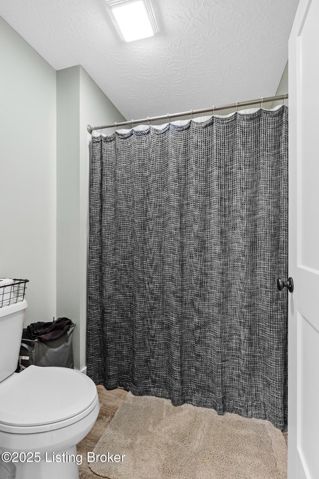 63 Davis Norton Ln, Harned, KY 40144 - bathroom featuring a textured ceiling and curtained shower