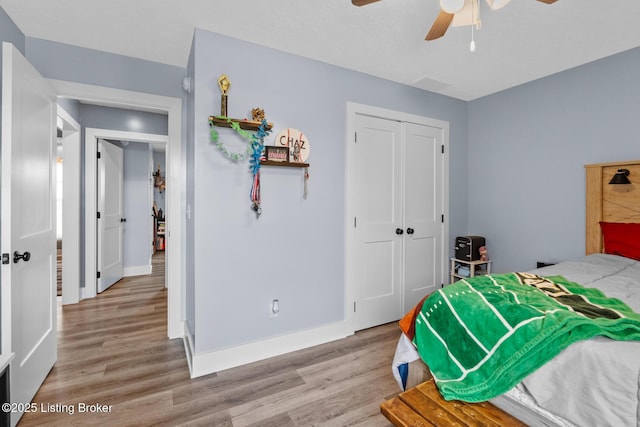 63 Davis Norton Ln, Harned, KY 40144 - bedroom with light wood-style floors, a closet, and a ceiling fan