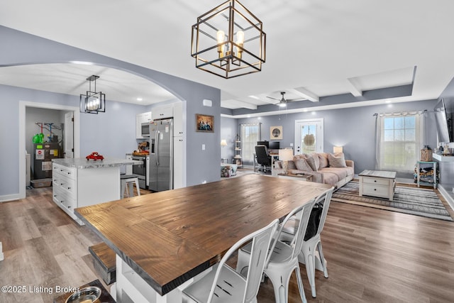 63 Davis Norton Ln, Harned, KY 40144 - dining room featuring arched walkways, a chandelier, a ceiling fan, light wood-style flooring, and a desk