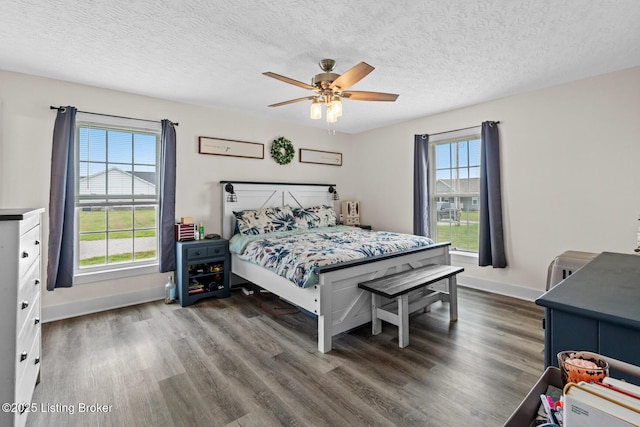 63 Davis Norton Ln, Harned, KY 40144 - bedroom featuring wood finished floors, a textured ceiling, and a ceiling fan