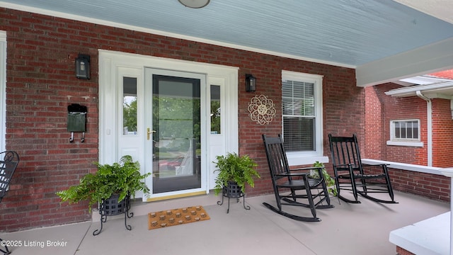 1910 Alfresco Pl, Louisville, KY 40205 - view of exterior entry featuring a porch and brick siding