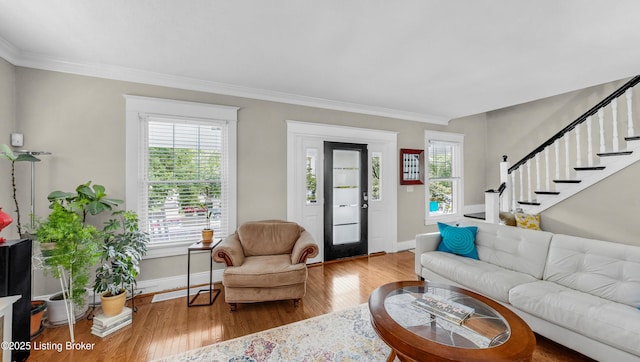 1910 Alfresco Pl, Louisville, KY 40205 - living room with wood finished floors, crown molding, and stairway