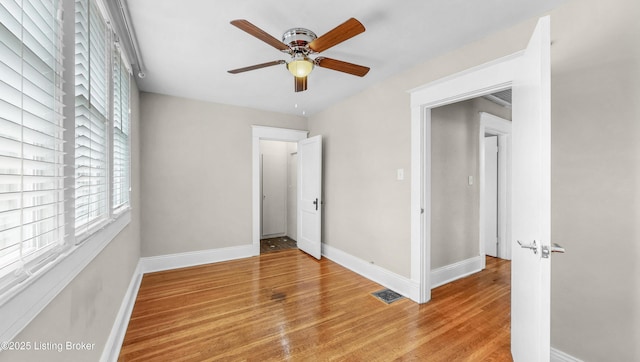 1910 Alfresco Pl, Louisville, KY 40205 - unfurnished bedroom featuring wood finished floors and a ceiling fan