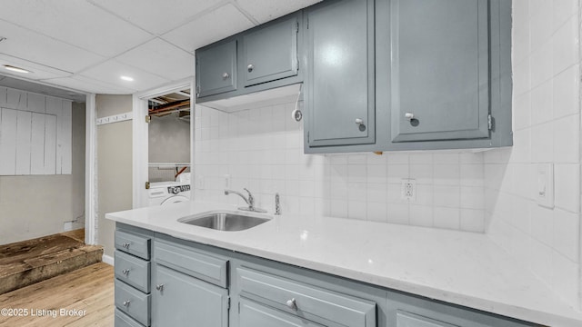 1910 Alfresco Pl, Louisville, KY 40205 - kitchen with gray cabinetry, light wood-type flooring, tasteful backsplash, recessed lighting, and a paneled ceiling