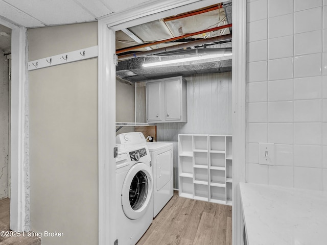 1910 Alfresco Pl, Louisville, KY 40205 - laundry room featuring cabinet space, independent washer and dryer, and light wood-type flooring