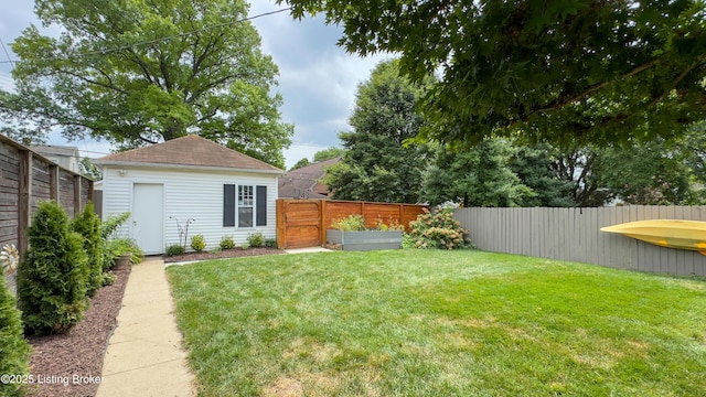 1910 Alfresco Pl, Louisville, KY 40205 - fenced backyard featuring a vegetable garden and an outbuilding