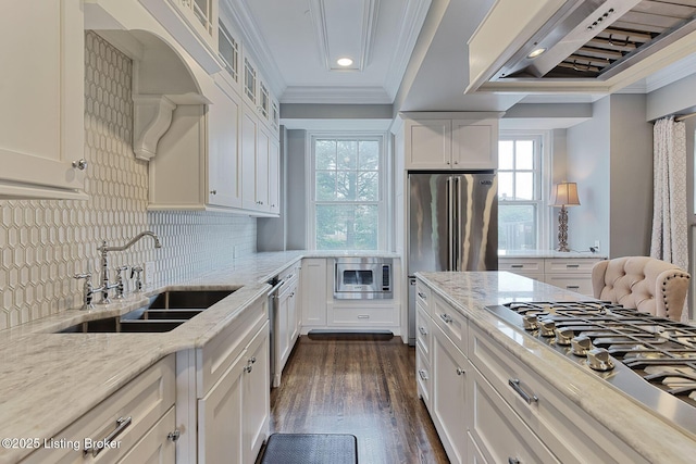 1416 Willow Ave Unit 3B, Louisville, KY 40204 - kitchen with crown molding, appliances with stainless steel finishes, exhaust hood, white cabinetry, and recessed lighting