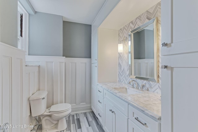 1416 Willow Ave Unit 3B, Louisville, KY 40204 - bathroom with a decorative wall, vanity, and wainscoting