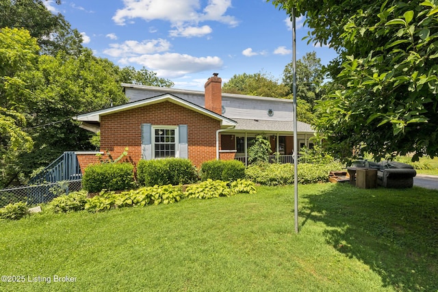 363 S Deepwood Dr, Radcliff, KY 40160 - rear view of house featuring brick siding and a chimney