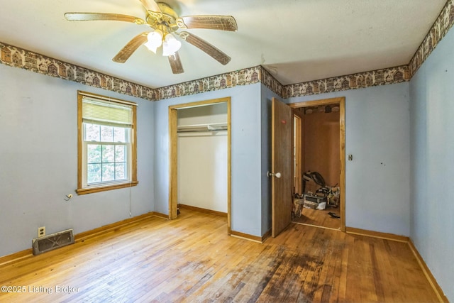 363 S Deepwood Dr, Radcliff, KY 40160 - unfurnished bedroom with wood-type flooring, a closet, and ceiling fan