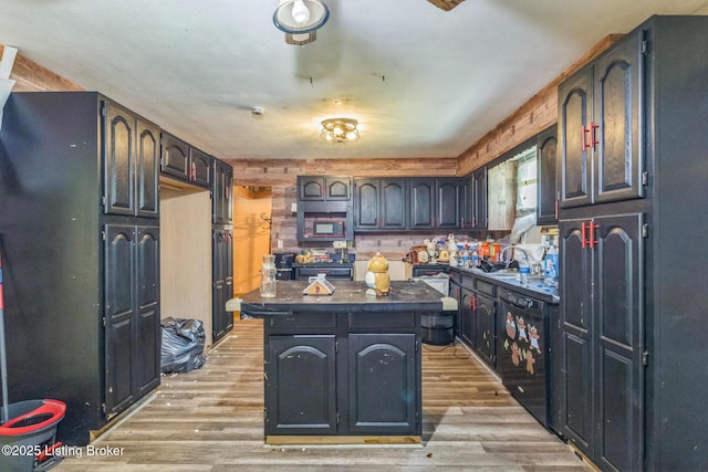 363 S Deepwood Dr, Radcliff, KY 40160 - kitchen featuring stainless steel microwave, dark countertops, range, light wood-style floors, and a kitchen island