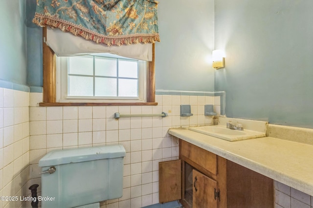 363 S Deepwood Dr, Radcliff, KY 40160 - bathroom with vanity, wainscoting, and tile walls