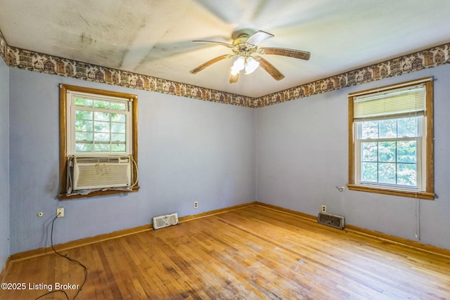 363 S Deepwood Dr, Radcliff, KY 40160 - unfurnished room with hardwood / wood-style flooring, cooling unit, healthy amount of natural light, and ceiling fan