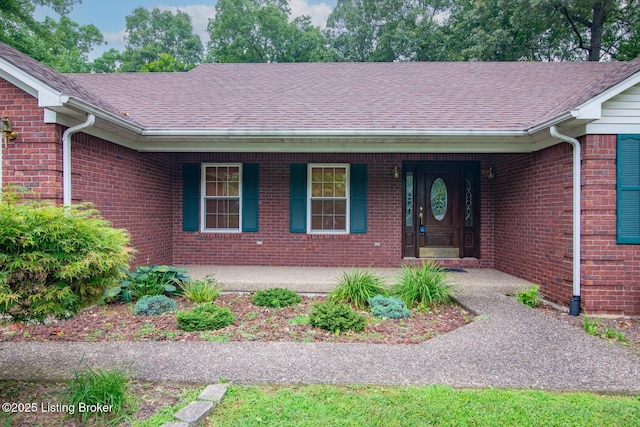 236 Bobwhite Rd, Brandenburg, KY 40108 - view of front of property with a porch, a shingled roof, and brick siding