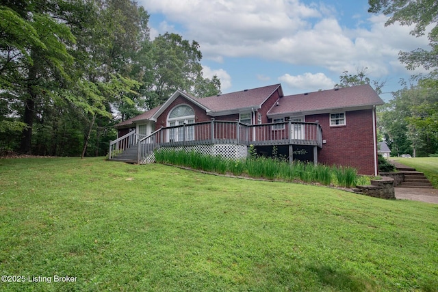 236 Bobwhite Rd, Brandenburg, KY 40108 - back of property featuring brick siding, a yard, and a wooden deck