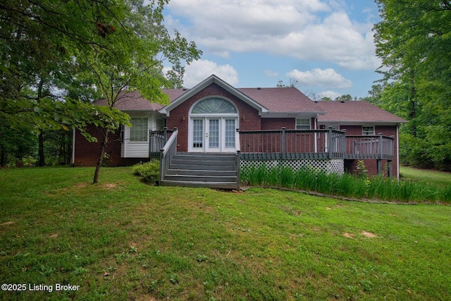 236 Bobwhite Rd, Brandenburg, KY 40108 - rear view of property featuring brick siding, a wooden deck, a yard, and french doors